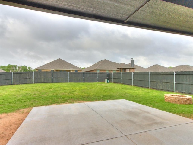 view of yard featuring a patio and a fenced backyard