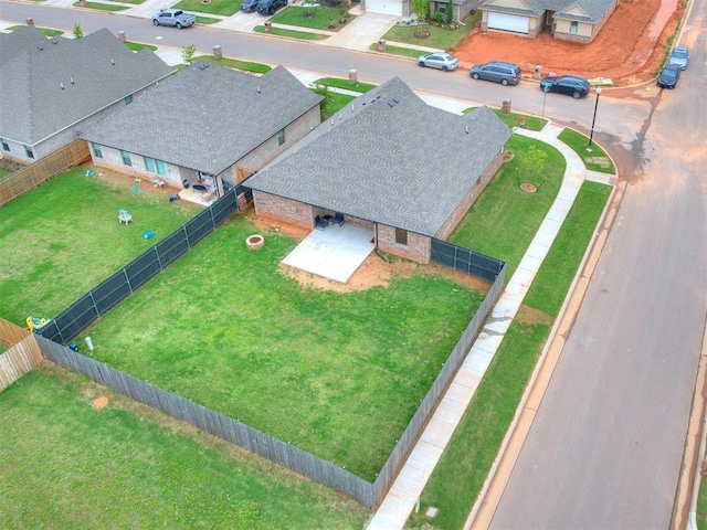 birds eye view of property with a residential view