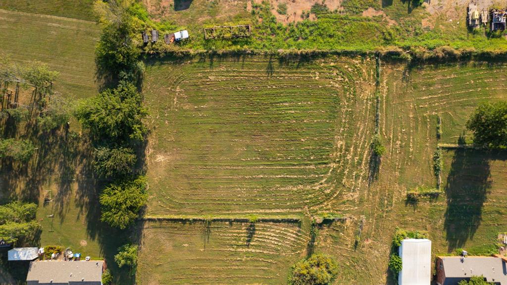 birds eye view of property featuring a rural view