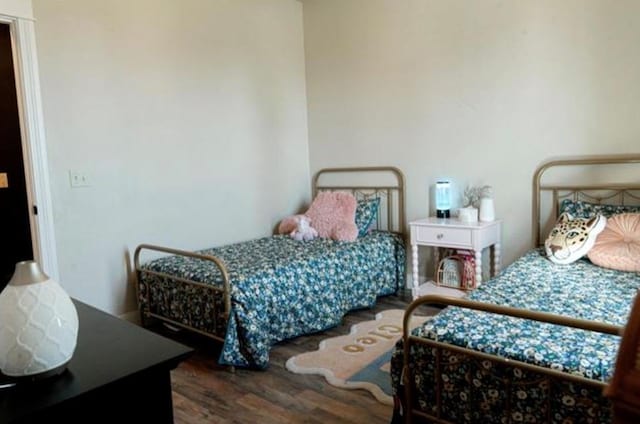 bedroom with wood finished floors