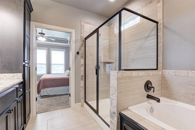 full bath with vanity, a shower stall, and a garden tub