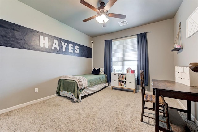carpeted bedroom featuring visible vents, a ceiling fan, and baseboards