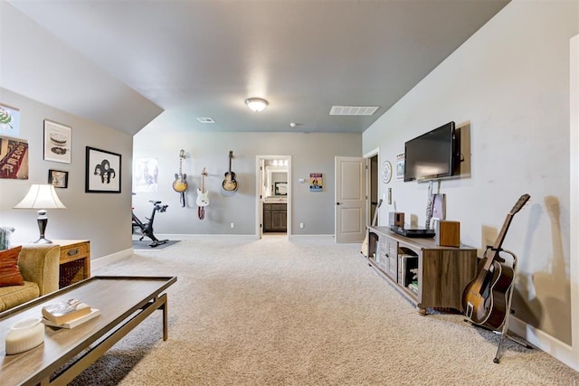 living area with light colored carpet, baseboards, and visible vents