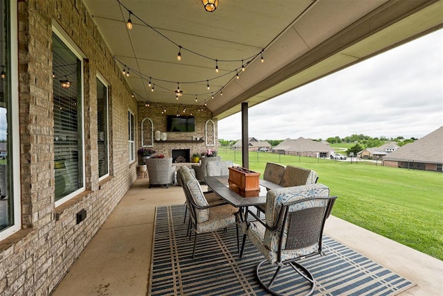 view of patio / terrace featuring an outdoor living space with a fireplace