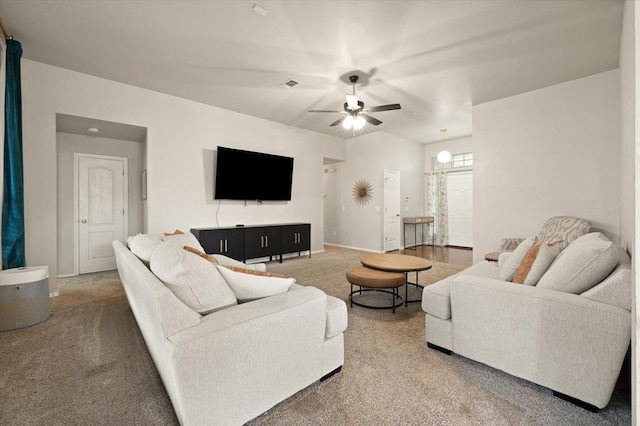 living room with baseboards, ceiling fan, carpet flooring, and visible vents