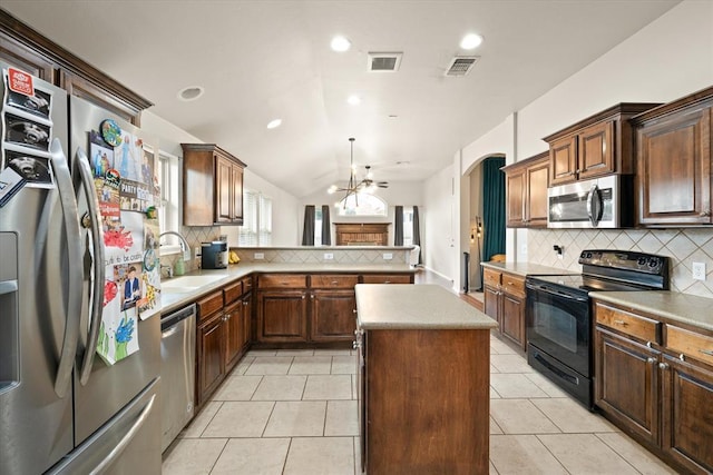 kitchen with backsplash, stainless steel appliances, visible vents, and a sink