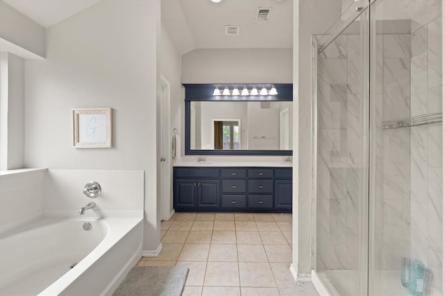 full bathroom featuring double vanity, a bath, a stall shower, a sink, and tile patterned floors