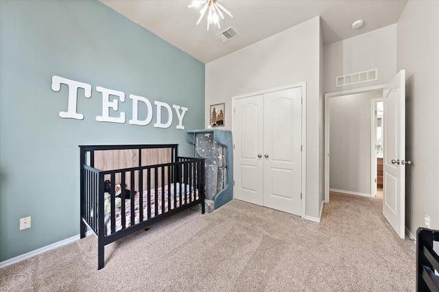 carpeted bedroom featuring visible vents, a nursery area, high vaulted ceiling, baseboards, and a closet
