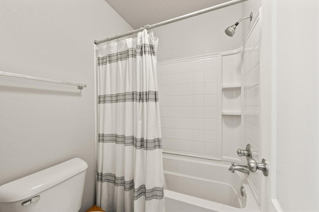 full bath with shower / bath combo with shower curtain and toilet
