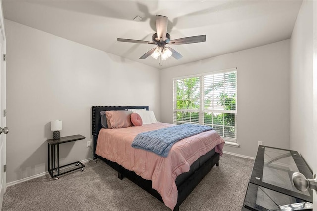 bedroom with carpet floors, baseboards, and ceiling fan