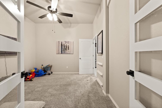 playroom with baseboards, carpet, and ceiling fan