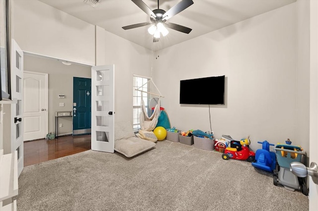 game room featuring a ceiling fan and carpet flooring
