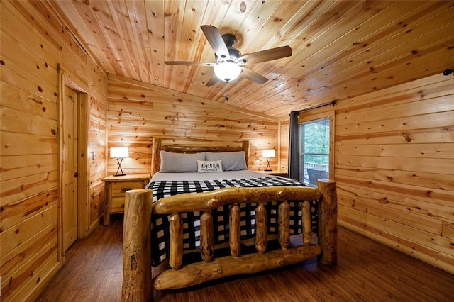 bedroom with wood walls, hardwood / wood-style floors, wooden ceiling, vaulted ceiling, and a ceiling fan