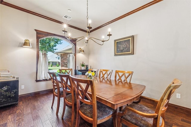 dining space with baseboards, ornamental molding, hardwood / wood-style floors, and visible vents