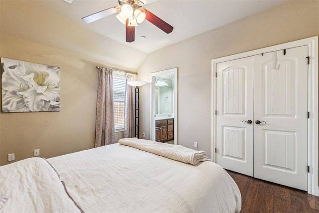 bedroom with a closet, wood finished floors, ensuite bath, vaulted ceiling, and ceiling fan