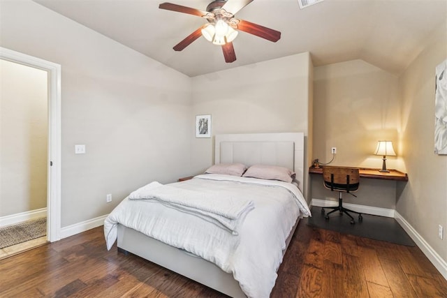 bedroom featuring vaulted ceiling, wood finished floors, baseboards, and ceiling fan