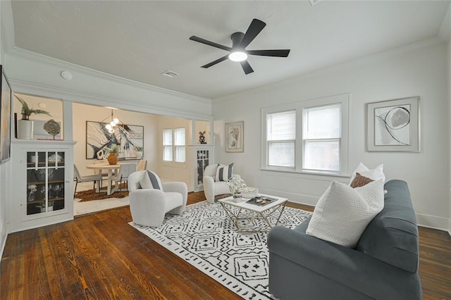 living area featuring ceiling fan, ornamental molding, baseboards, visible vents, and dark wood-style floors