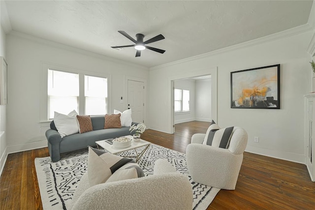 living room featuring crown molding, baseboards, ceiling fan, and hardwood / wood-style flooring