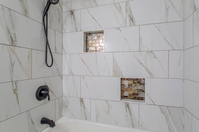 interior space featuring shower / tub combination