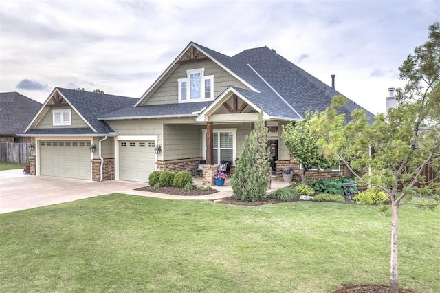 craftsman house featuring roof with shingles, a front lawn, brick siding, covered porch, and driveway
