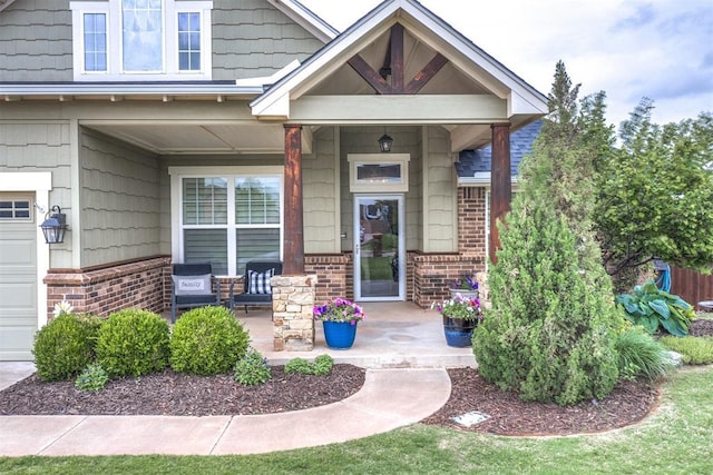 property entrance featuring a porch and brick siding