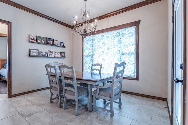 dining room featuring crown molding, baseboards, and a chandelier
