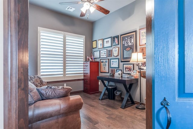 home office with ceiling fan, wood finished floors, and visible vents