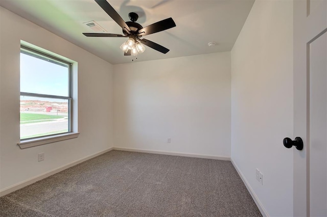 empty room with baseboards, carpet, and ceiling fan