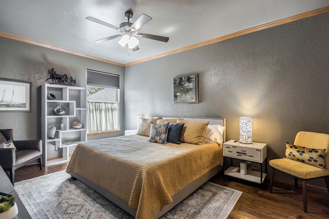 bedroom with ornamental molding, a textured wall, and wood finished floors