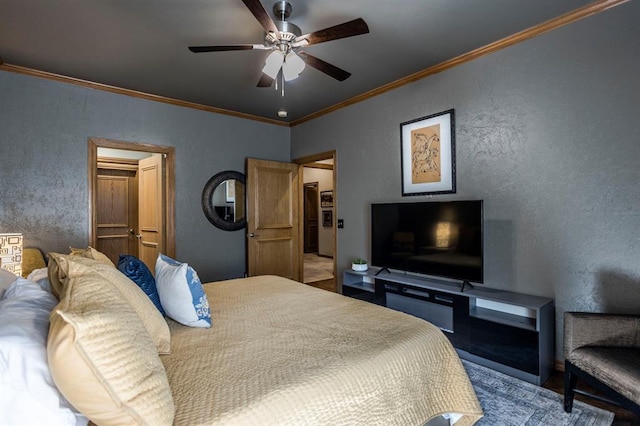 bedroom featuring crown molding, a textured wall, and ceiling fan