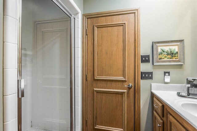 full bathroom with vanity and a stall shower