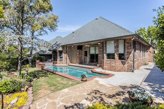 pool featuring a patio and a jacuzzi