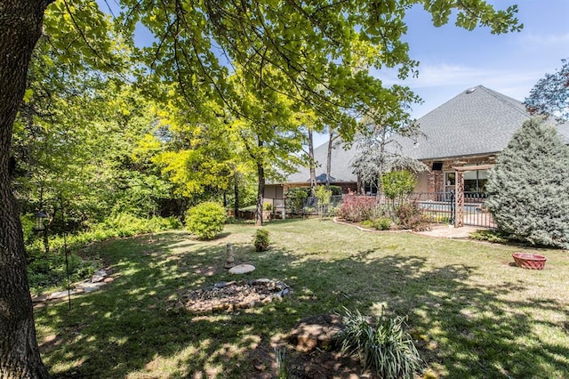 view of yard with fence