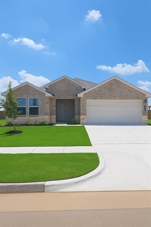 10304 NW 28th St, Yukon, OK 73099 - ranch-style house with a garage, concrete driveway, brick siding, and a front yard