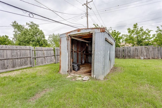 view of outbuilding featuring an outdoor structure and a fenced backyard