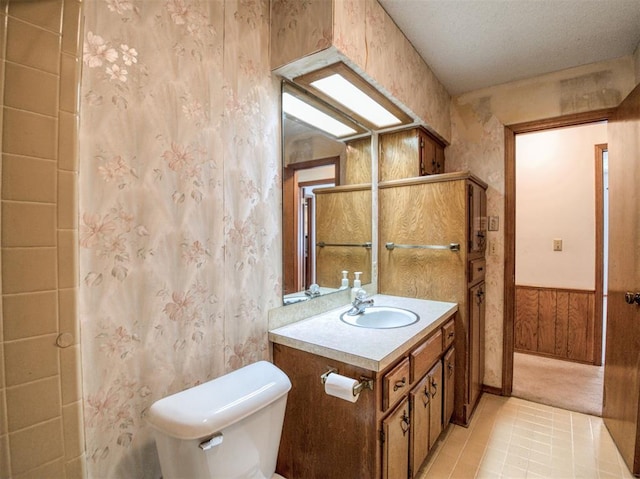 full bath featuring tile patterned floors, toilet, and vanity