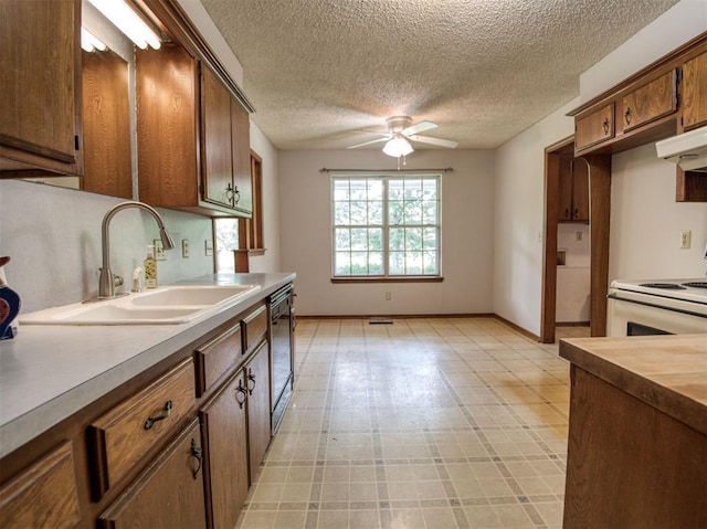 kitchen featuring a sink, black dishwasher, a textured ceiling, ceiling fan, and white electric stove