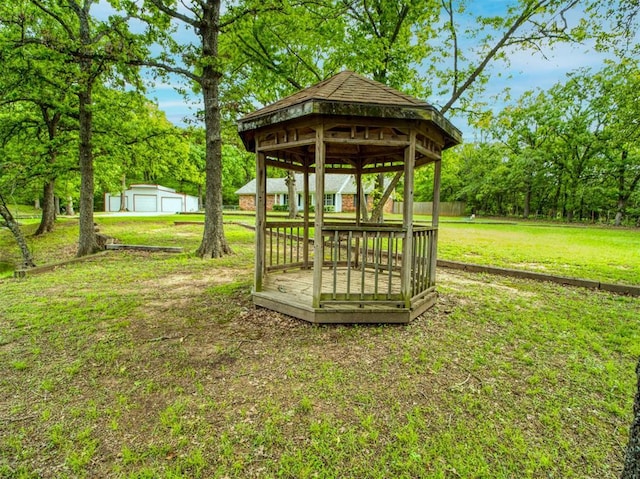 view of yard featuring an outdoor structure, a gazebo, and a garage