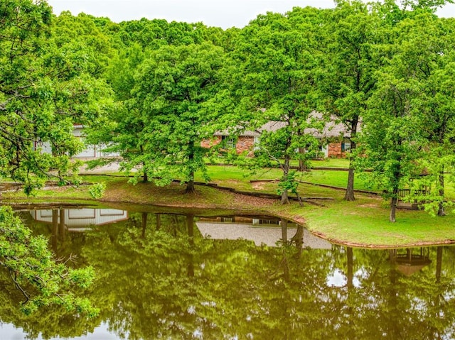 surrounding community featuring a water view
