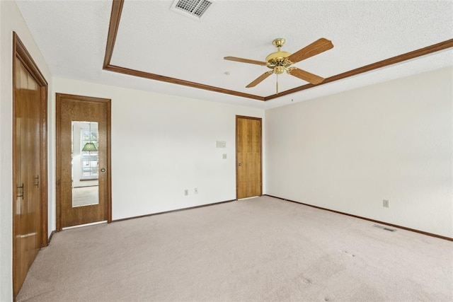 empty room featuring light colored carpet and visible vents