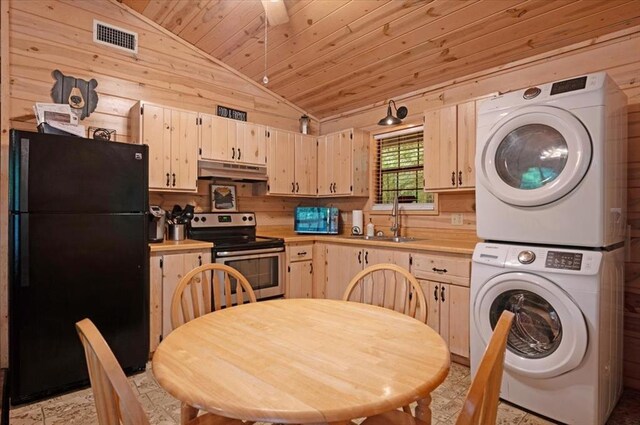 206 Orca Rd, Broken Bow, OK 74728 - kitchen featuring freestanding refrigerator, electric stove, estacked washer and dryer, under cabinet range hood, and a sink