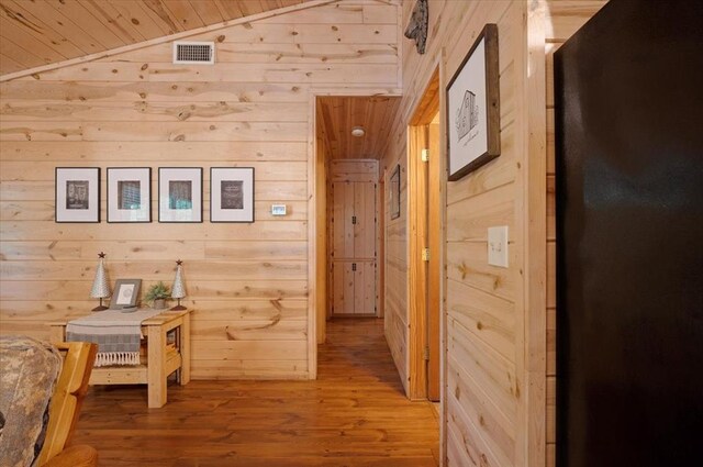 206 Orca Rd, Broken Bow, OK 74728 - corridor featuring wood walls, wood finished floors, lofted ceiling, and wooden ceiling