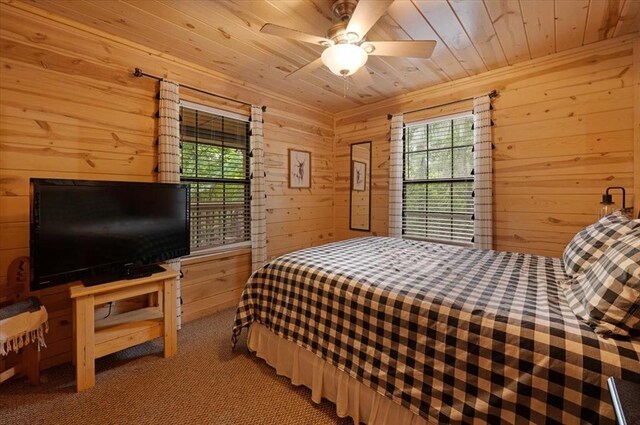 206 Orca Rd, Broken Bow, OK 74728 - bedroom featuring wood walls, wood ceiling, and light colored carpet