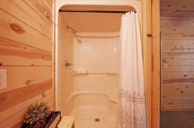 206 Orca Rd, Broken Bow, OK 74728 - bathroom with curtained shower and wooden walls