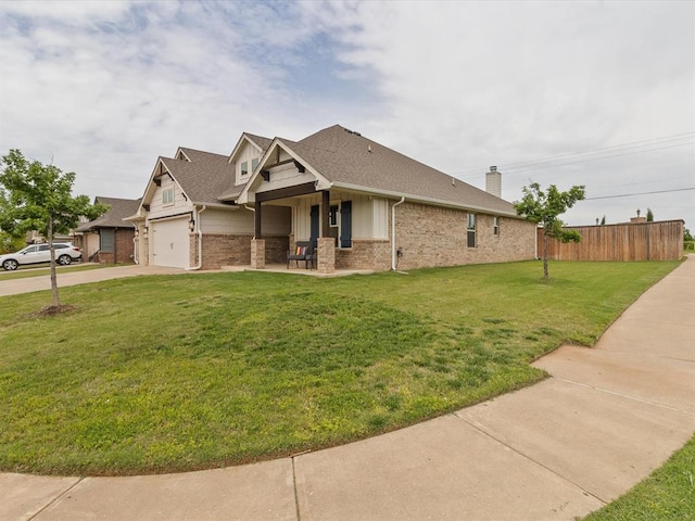 view of front of property with brick siding, fence, a garage, concrete driveway, and a front lawn