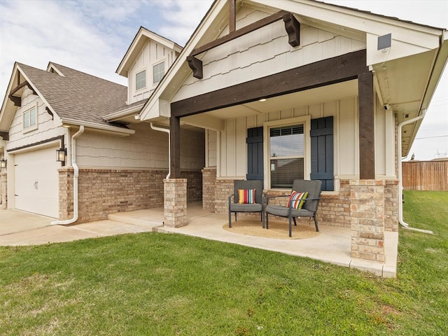 exterior space featuring board and batten siding, fence, a garage, a porch, and a front lawn