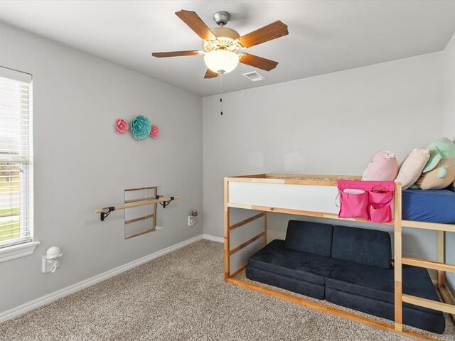 bedroom with carpet flooring, baseboards, a ceiling fan, and visible vents