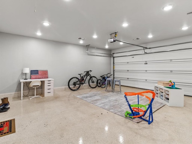 garage featuring recessed lighting, baseboards, and a garage door opener