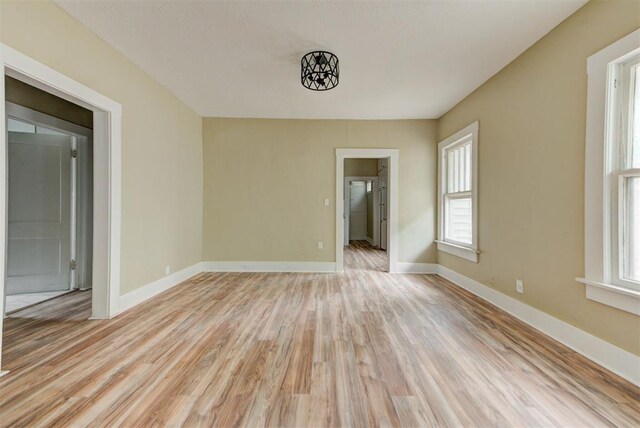 1629 Birch St, Oklahoma City, OK 73108 - empty room featuring baseboards and light wood-type flooring