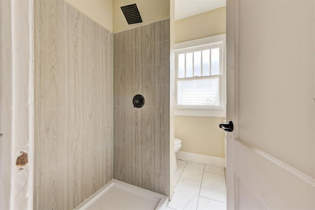 1629 Birch St, Oklahoma City, OK 73108 - bathroom featuring toilet, marble finish floor, and tiled shower